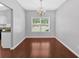 Bright dining area with elegant chandelier, natural light, and hardwood flooring at 40 Polo Xing, Hiram, GA 30141