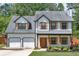 Charming two-story home with a two-car garage and inviting front porch at 40 Polo Xing, Hiram, GA 30141
