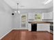 Well-lit kitchen with white cabinets, hardwood floors, and modern appliances at 40 Polo Xing, Hiram, GA 30141