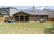 Spacious backyard with patio, screened in porch, and partial fence at 4690 Hopewell Manor Dr, Cumming, GA 30028
