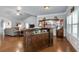 Open floor plan featuring a custom-built bar area adjacent to the living room at 4690 Hopewell Manor Dr, Cumming, GA 30028