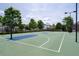 Outdoor basketball court with well-lit setting at 4690 Hopewell Manor Dr, Cumming, GA 30028