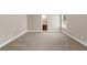 Empty bedroom with neutral color paint, carpet, and view into the bathroom at 4690 Hopewell Manor Dr, Cumming, GA 30028
