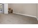 Bedroom with neutral colored paint, carpet, with open door to hall at 4690 Hopewell Manor Dr, Cumming, GA 30028