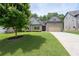 Charming two-story home featuring a well-manicured lawn and an attached two-car garage at 4690 Hopewell Manor Dr, Cumming, GA 30028