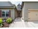 Charming two-story home featuring a well-manicured walkway to the front door and attached two-car garage at 4690 Hopewell Manor Dr, Cumming, GA 30028