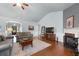 Bright living room showcasing hardwood floors, a fireplace, and an open layout with modern decor at 4690 Hopewell Manor Dr, Cumming, GA 30028