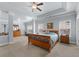 Spacious main bedroom featuring a tray ceiling, sitting area, and an ensuite bath at 4690 Hopewell Manor Dr, Cumming, GA 30028