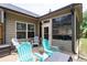 Charming patio with stylish outdoor seating, perfect for relaxation or entertaining with a view of the screen porch at 4690 Hopewell Manor Dr, Cumming, GA 30028