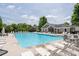 Large community pool surrounded by lounge chairs for ultimate relaxation and enjoyment at 4690 Hopewell Manor Dr, Cumming, GA 30028
