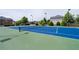 Well-maintained tennis court in a community setting, ready for a game at 4690 Hopewell Manor Dr, Cumming, GA 30028