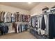 Spacious walk-in closet with ample storage racks for clothes, shoes, and other personal belongings at 4690 Hopewell Manor Dr, Cumming, GA 30028