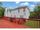 Relax on the beautiful red deck and enjoy the greenery of this charming backyard at 6031 Hitt Lake Ct, Stone Mountain, GA 30087