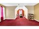 Bright bedroom featuring neutral walls, plush carpet, and natural lighting at 6031 Hitt Lake Ct, Stone Mountain, GA 30087