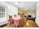 Bright dining area with hardwood floors open to the living room, great for entertaining at 6031 Hitt Lake Ct, Stone Mountain, GA 30087