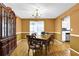 Traditional dining room featuring hardwood floors and classic furnishings at 6031 Hitt Lake Ct, Stone Mountain, GA 30087