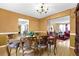 Spacious dining room with a view of the living room; features hardwood flooring at 6031 Hitt Lake Ct, Stone Mountain, GA 30087
