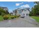 Charming two-story home with well-manicured lawn and a driveway for multiple cars at 6031 Hitt Lake Ct, Stone Mountain, GA 30087