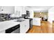 Well-lit kitchen with white countertops, modern appliances, and hardwood flooring at 6031 Hitt Lake Ct, Stone Mountain, GA 30087