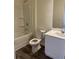 Bathroom featuring a tub with shower and a single sink at 7785 Sudbury Cir, Covington, GA 30014