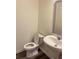 Clean bathroom with modern fixtures and a pedestal sink at 7785 Sudbury Cir, Covington, GA 30014