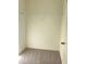 This bedroom closet features plush carpet flooring and a wire shelf at 7785 Sudbury Cir, Covington, GA 30014