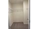 This bedroom closet features plush carpet flooring and a wire shelf at 7785 Sudbury Cir, Covington, GA 30014
