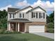 Charming two-story home features a brick facade and well-maintained landscaping at 7785 Sudbury Cir, Covington, GA 30014