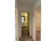 This hallway provides access to the bathroom, which features a vanity with storage at 7785 Sudbury Cir, Covington, GA 30014
