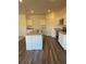 Modern kitchen with granite countertops and stainless steel appliances at 7785 Sudbury Cir, Covington, GA 30014