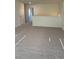 Upstairs loft area with neutral carpeting and natural light at 7785 Sudbury Cir, Covington, GA 30014