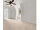 View of an upstairs bedroom with neutral colored carpet, a window seat, and an ensuite bathroom at 10000 Groomsbridge Rd, Johns Creek, GA 30022