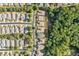 An aerial view of a suburban neighborhood with tree-lined streets and well-maintained homes at 120 Laurel Rdg, Canton, GA 30114