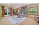 Finished basement with natural light, stone accent wall, and comfortable seating area at 120 Laurel Rdg, Canton, GA 30114