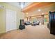Finished basement with a leather sofa, carpeted flooring, stone columns, and recessed lighting at 120 Laurel Rdg, Canton, GA 30114