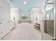 Bright bathroom boasts a soaking tub under a window, vanity, and a separate glass shower at 120 Laurel Rdg, Canton, GA 30114