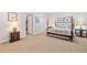 Spacious carpeted bedroom with a four-poster bed and warm, inviting decor at 120 Laurel Rdg, Canton, GA 30114