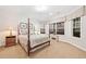 A comfy bedroom with a bay window providing natural light and stylish window coverings at 120 Laurel Rdg, Canton, GA 30114