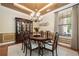 Formal dining room featuring a wood table, china cabinet, and a large window at 120 Laurel Rdg, Canton, GA 30114