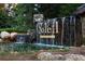 Elegant Soleil Laurel Canyon community entrance with rock waterfall and lush landscaping at 120 Laurel Rdg, Canton, GA 30114
