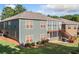 Rear exterior of a two-story home with a lawn, staircase, and a screened-in porch at 120 Laurel Rdg, Canton, GA 30114