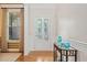 Elegant foyer with a glass-paneled door, hardwood floors, and decorative accents at 120 Laurel Rdg, Canton, GA 30114