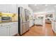 Bright kitchen with stainless steel appliances, granite countertops, and hardwood floors at 120 Laurel Rdg, Canton, GA 30114