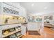 Well-appointed kitchen boasting custom cabinets, granite counters, and a view into the living area at 120 Laurel Rdg, Canton, GA 30114