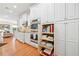 Chef's kitchen featuring custom cabinetry, stainless appliances, and hardwood flooring at 120 Laurel Rdg, Canton, GA 30114