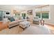 Inviting living room with large windows, natural light, and a view of the outdoors at 120 Laurel Rdg, Canton, GA 30114