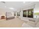 Bright main bedroom featuring large windows, a seating area, and neutral decor at 120 Laurel Rdg, Canton, GA 30114