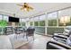 The sunroom includes a set of chairs and great views of the outdoors at 120 Laurel Rdg, Canton, GA 30114