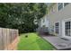 Lush backyard with a patio, perfect for outdoor entertaining and relaxation at 621 Kenridge Way # 0, Suwanee, GA 30024