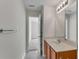 Bright bathroom features a modern vanity, large mirror, and stylish lighting at 621 Kenridge Way # 0, Suwanee, GA 30024